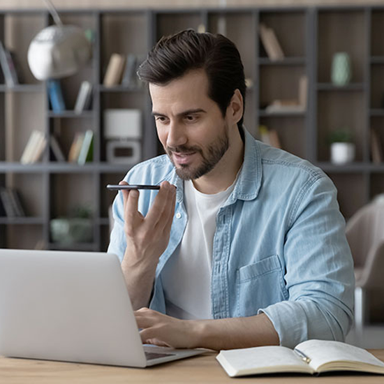 Young professional using Philips SpeechLive for professional transcription and documentation