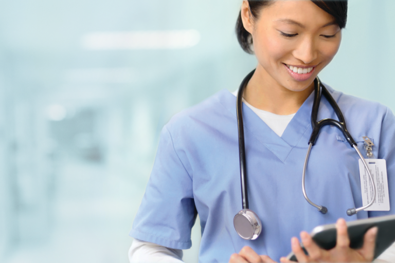 Doctor using Dragon Medical One for medical speech recognition and dictation