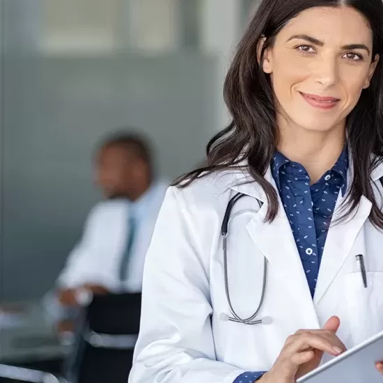 Doctor using Dragon Medical One for medical speech recognition and dictation for Canadian Healthcare Documentation