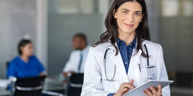 Doctor using Dragon Medical One for medical speech recognition and dictation for Canadian Healthcare Documentation