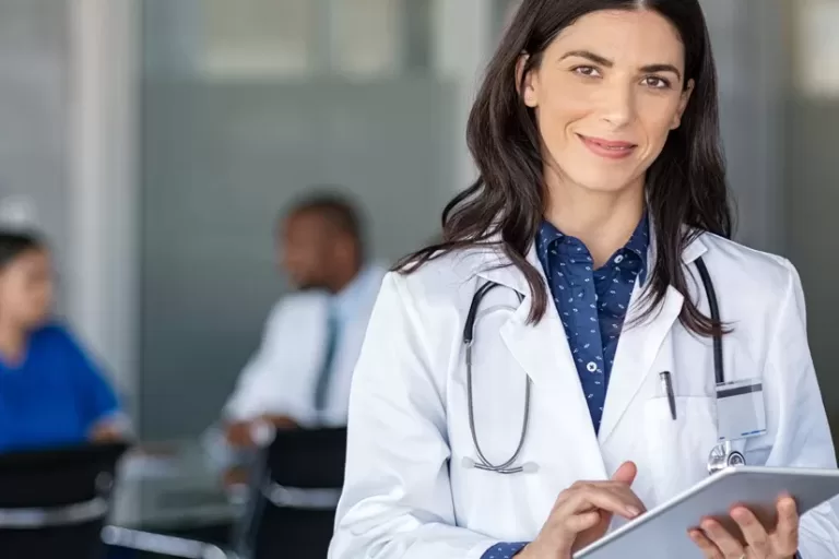 Doctor using Dragon Medical One for medical speech recognition and dictation for Canadian Healthcare Documentation